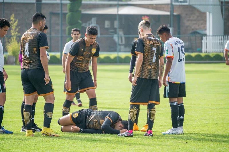 Football team, player on the field with an injury.